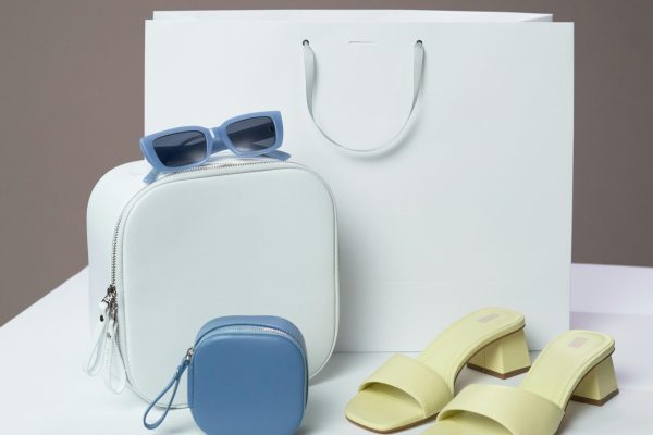 pexels-photo-9595288-9595288 Stylish display of fashion accessories including sandals and sunglasses for a modern look.
